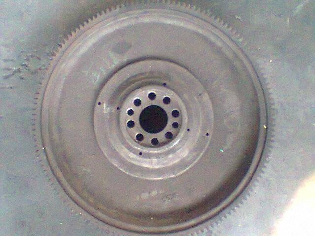Flywheel raw casting, coarse surface, bores not yet finish machined