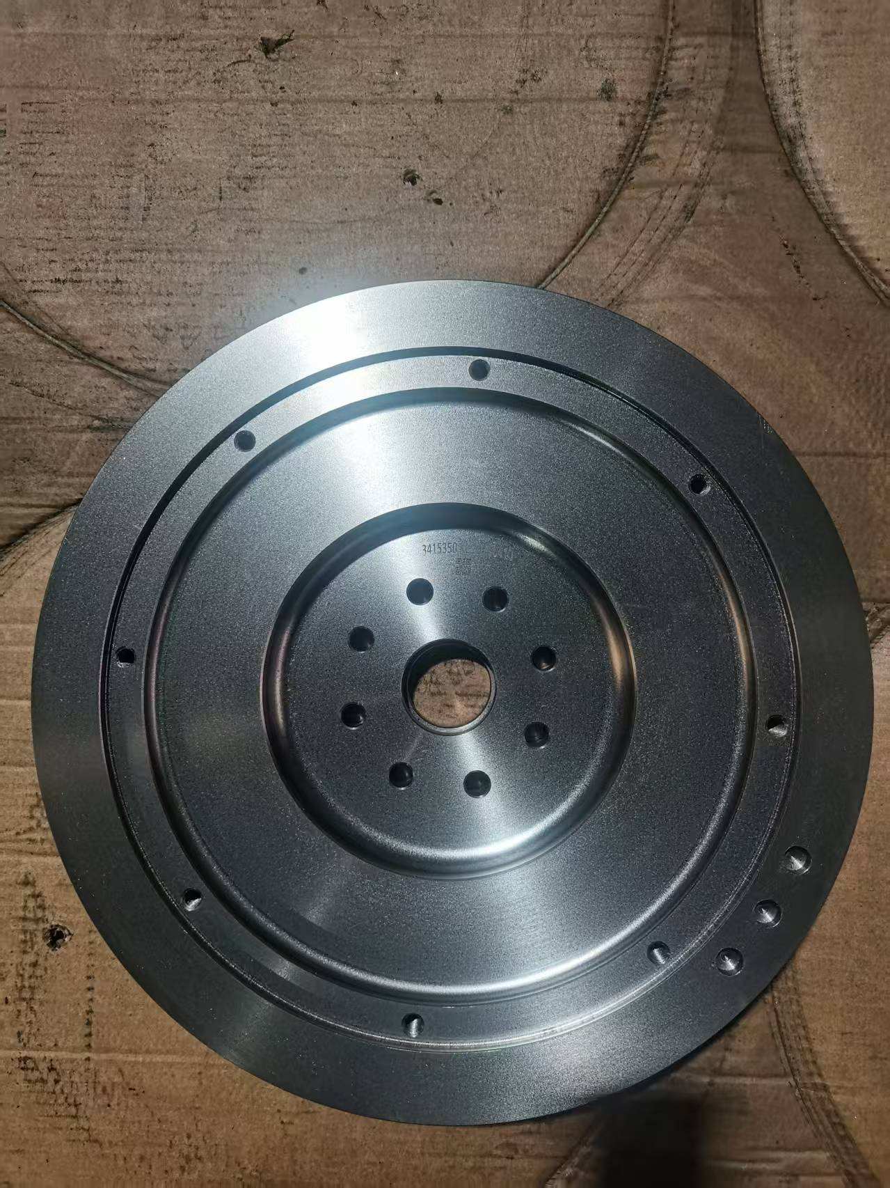 Cummins engineering flywheel crank end, with an eight-bolt circle around the centre