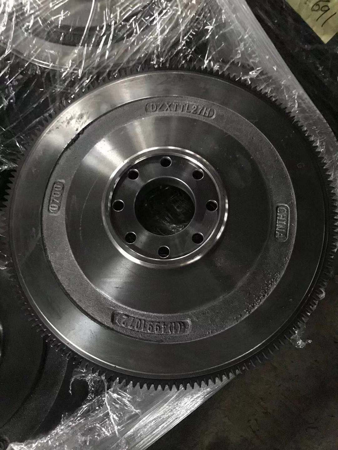 Cummins flywheel face, showing the centre bolt circle and the ring of signal holes