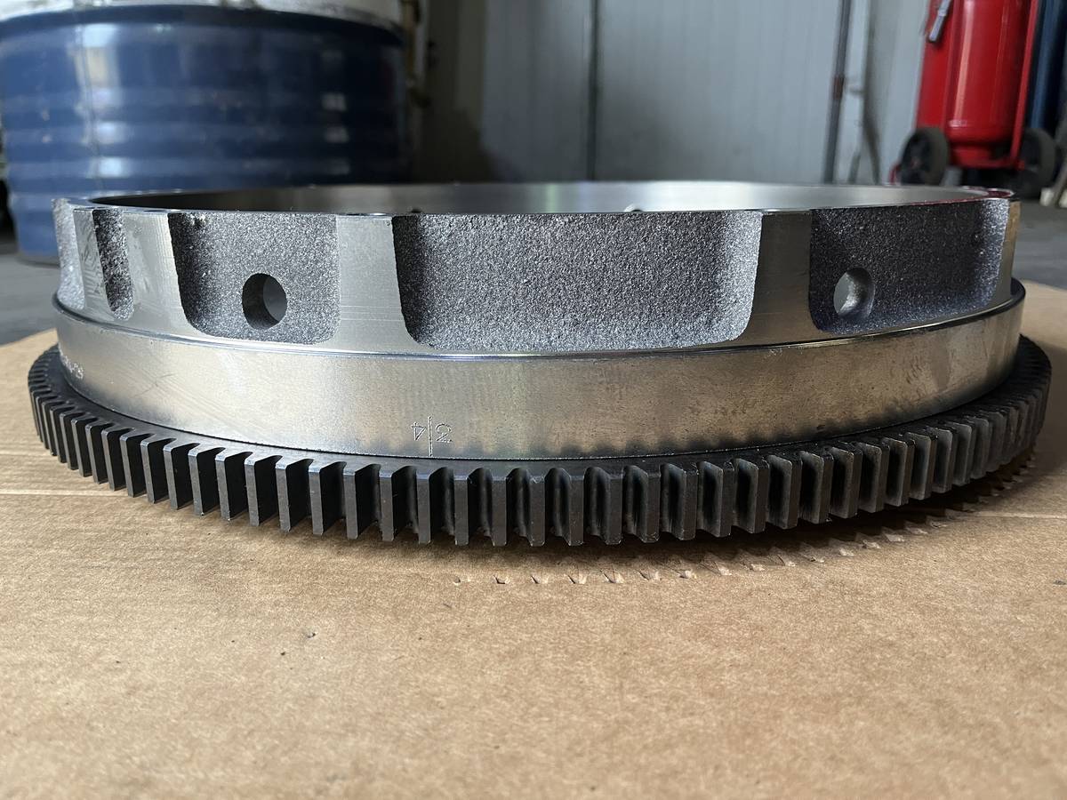 Machined flywheel, side view showing mounting bore and bolt holes