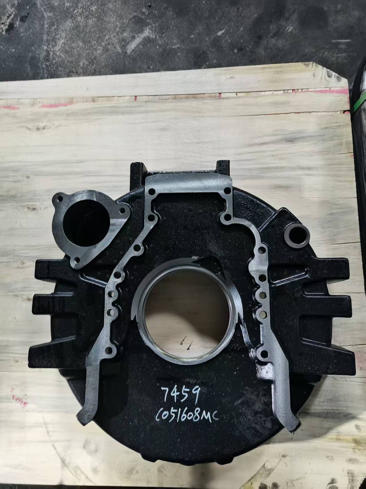 Komatsu P300 flywheel housing, machined rear face with multiple bolt patterns