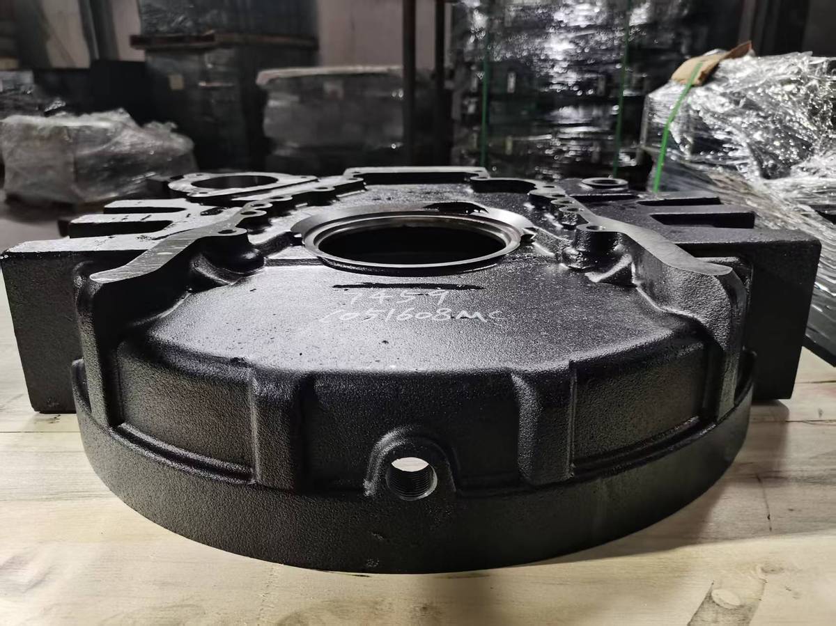 Komatsu P300 flywheel housing in side view showing the depth of the casting