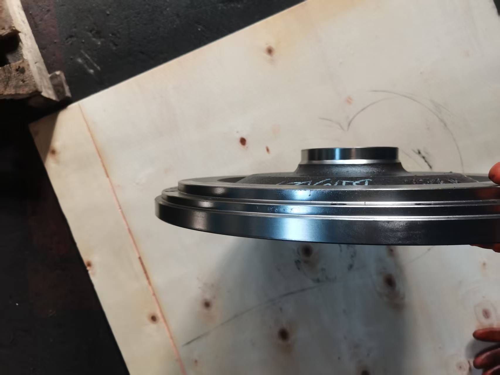 Heavy-duty truck flywheel, side view showing the wide cross-section that needs two-plane balancing