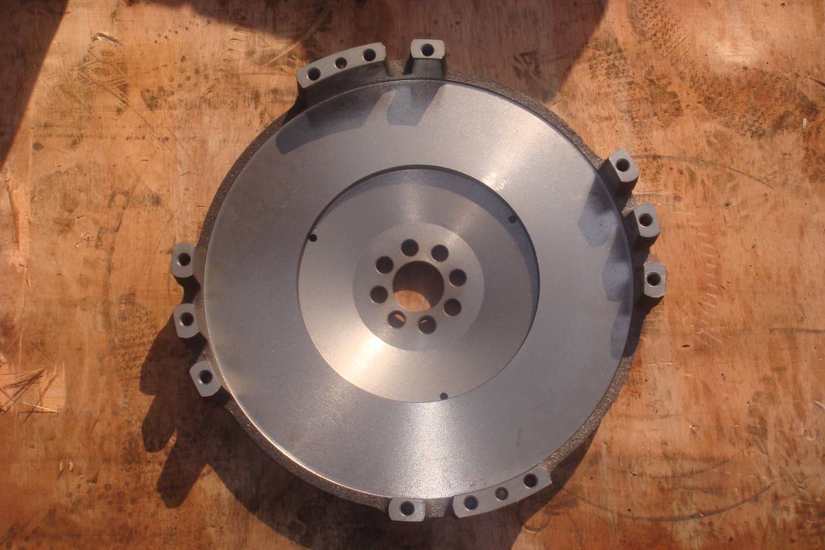 HINO J08C flywheel, rear face showing the crank mounting hub and machined register