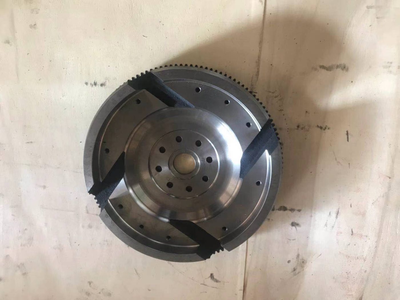 Komatsu P200 flywheel crank side, with the centre recessed and the outer face flat